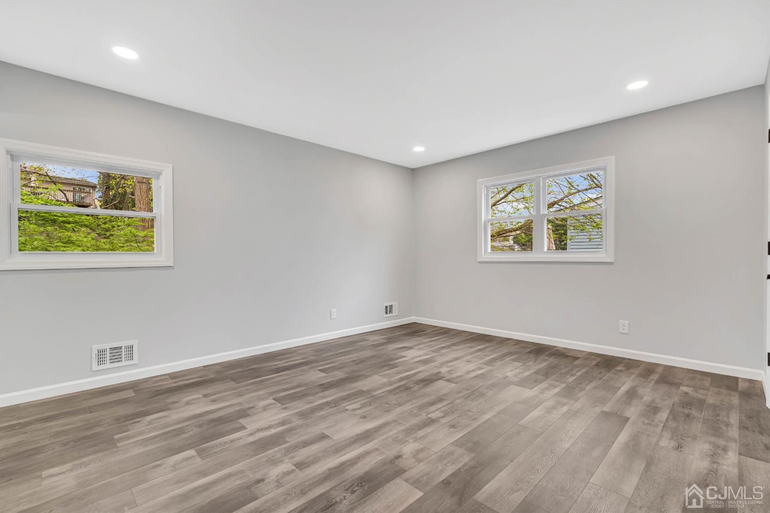 45 Harmon Road Edison, NJ 08837 - Photo 38 of 44 a view of room with window and wooden floor