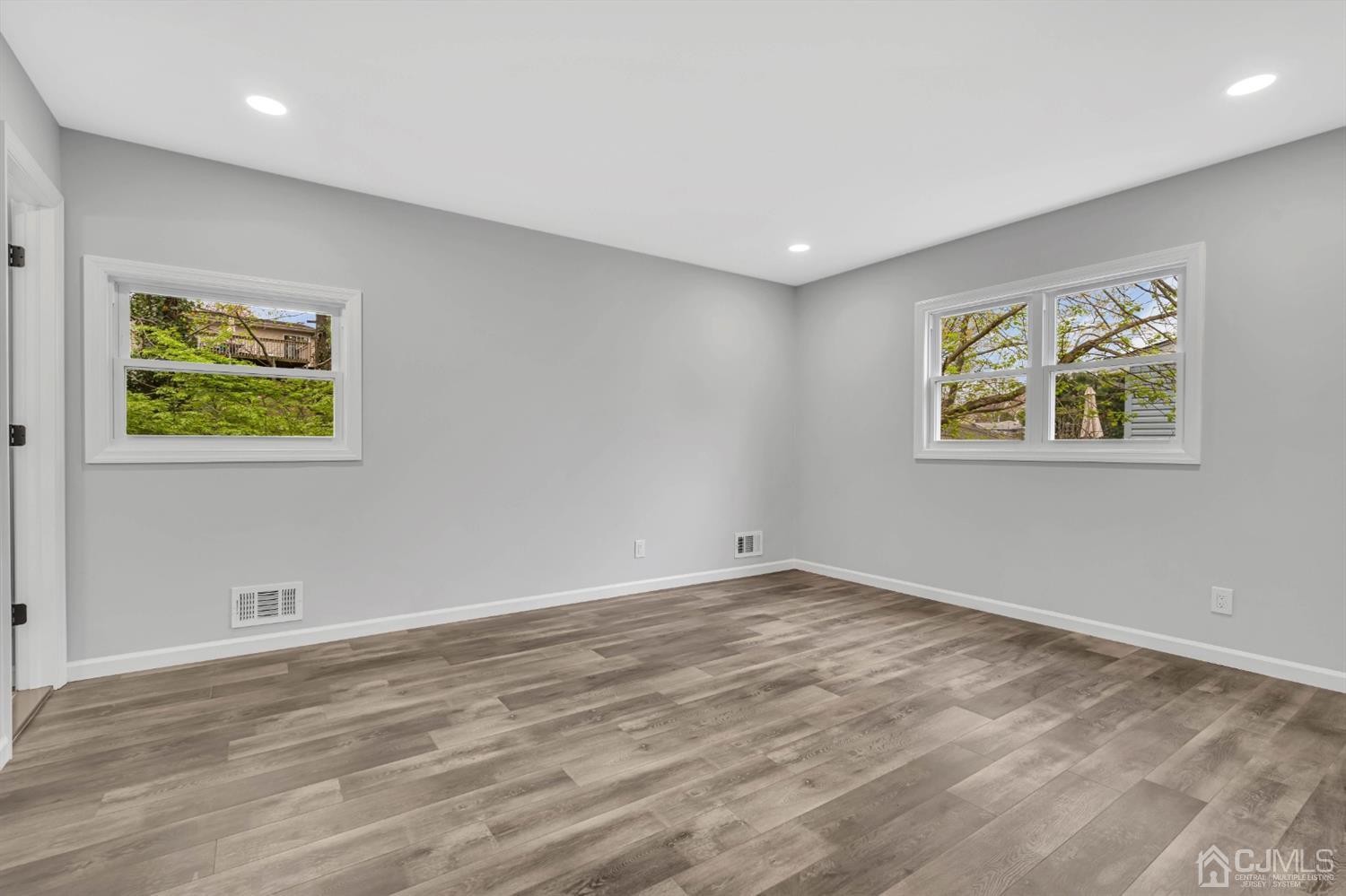 45 Harmon Road Edison, NJ 08837 - Photo 39 of 44 a view of room with window and wooden floor