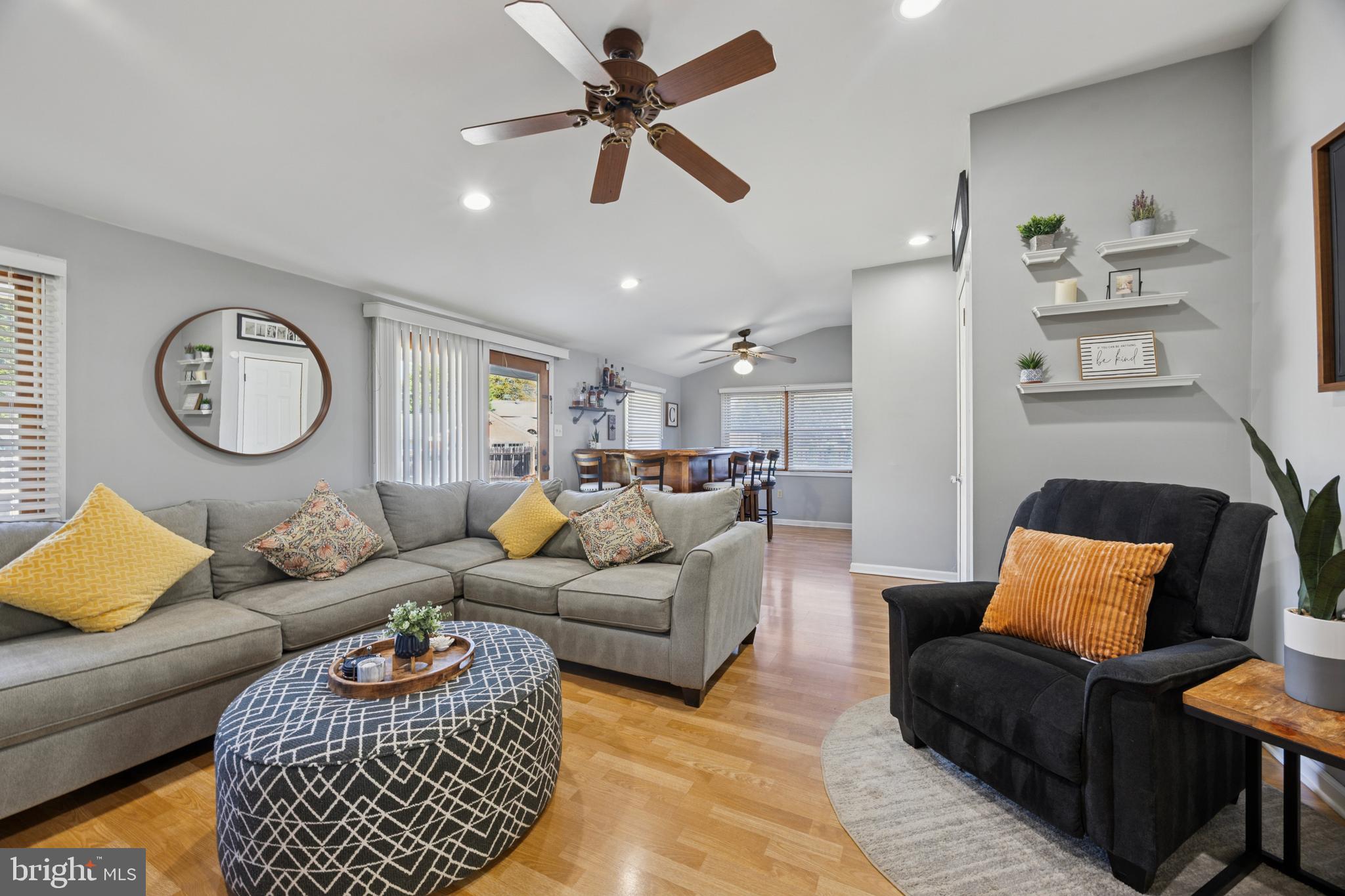 487 East Springfield Road Springfield, PA 19064 - Photo 12 of 29 a living room with furniture a rug and a wall painting