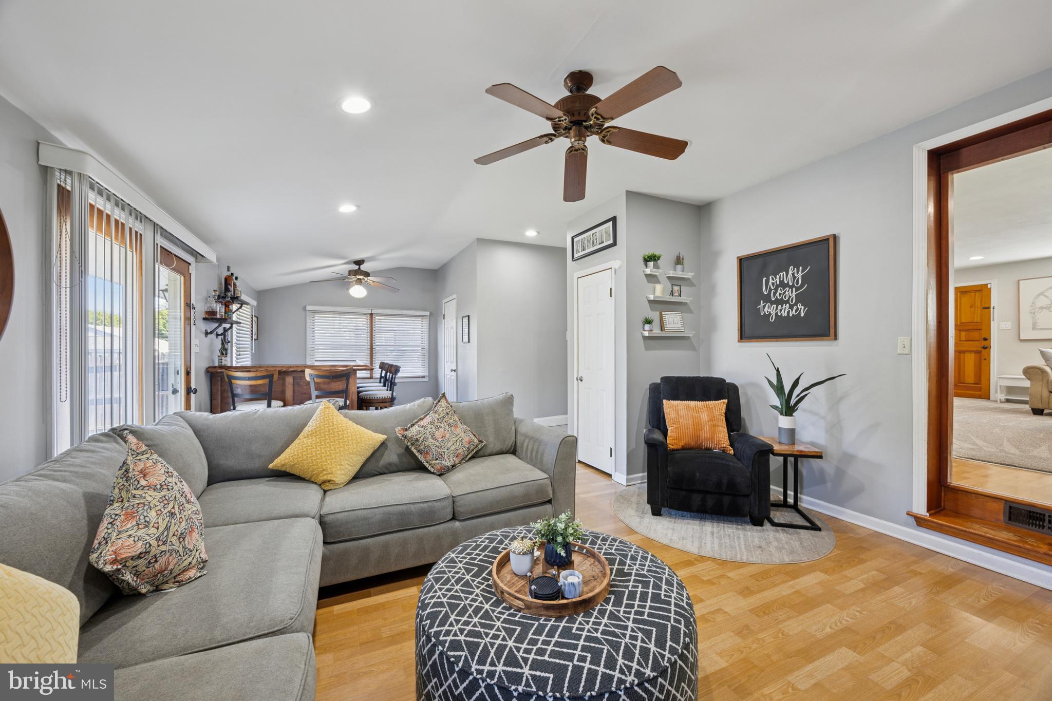 487 East Springfield Road Springfield, PA 19064 - Photo 13 of 29 a living room with furniture ceiling fan and a rug