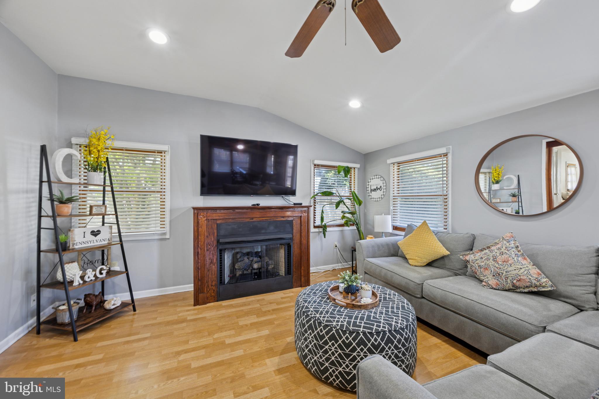 487 East Springfield Road Springfield, PA 19064 - Photo 14 of 29 a living room with furniture and a flat screen tv