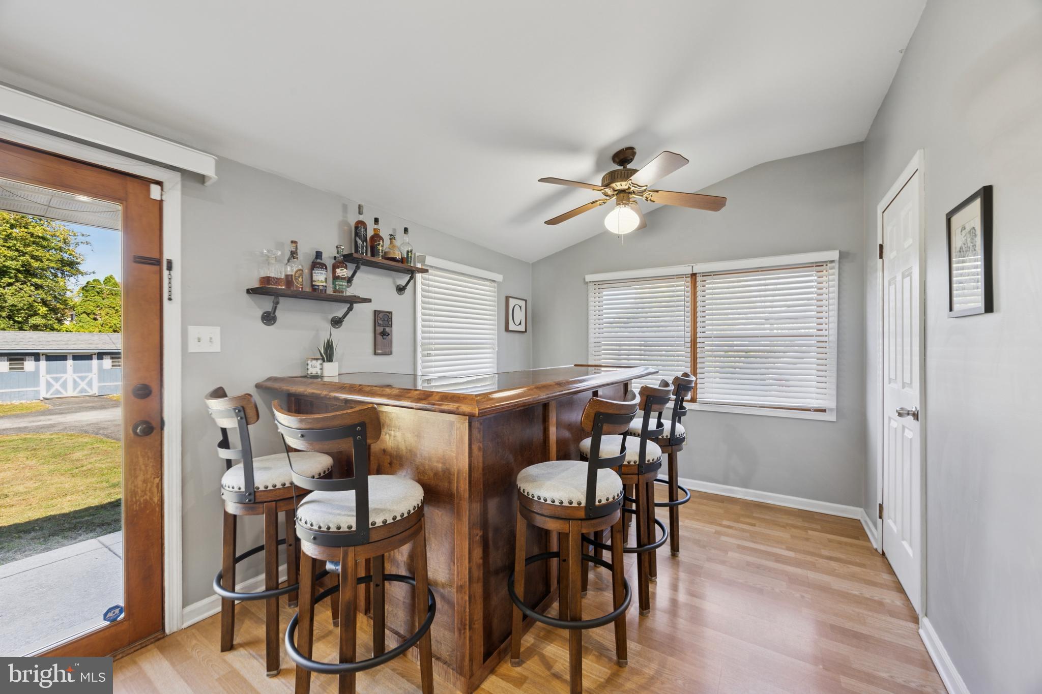 487 East Springfield Road Springfield, PA 19064 - Photo 15 of 29 a view of a dining room with furniture a chandelier and wooden floor