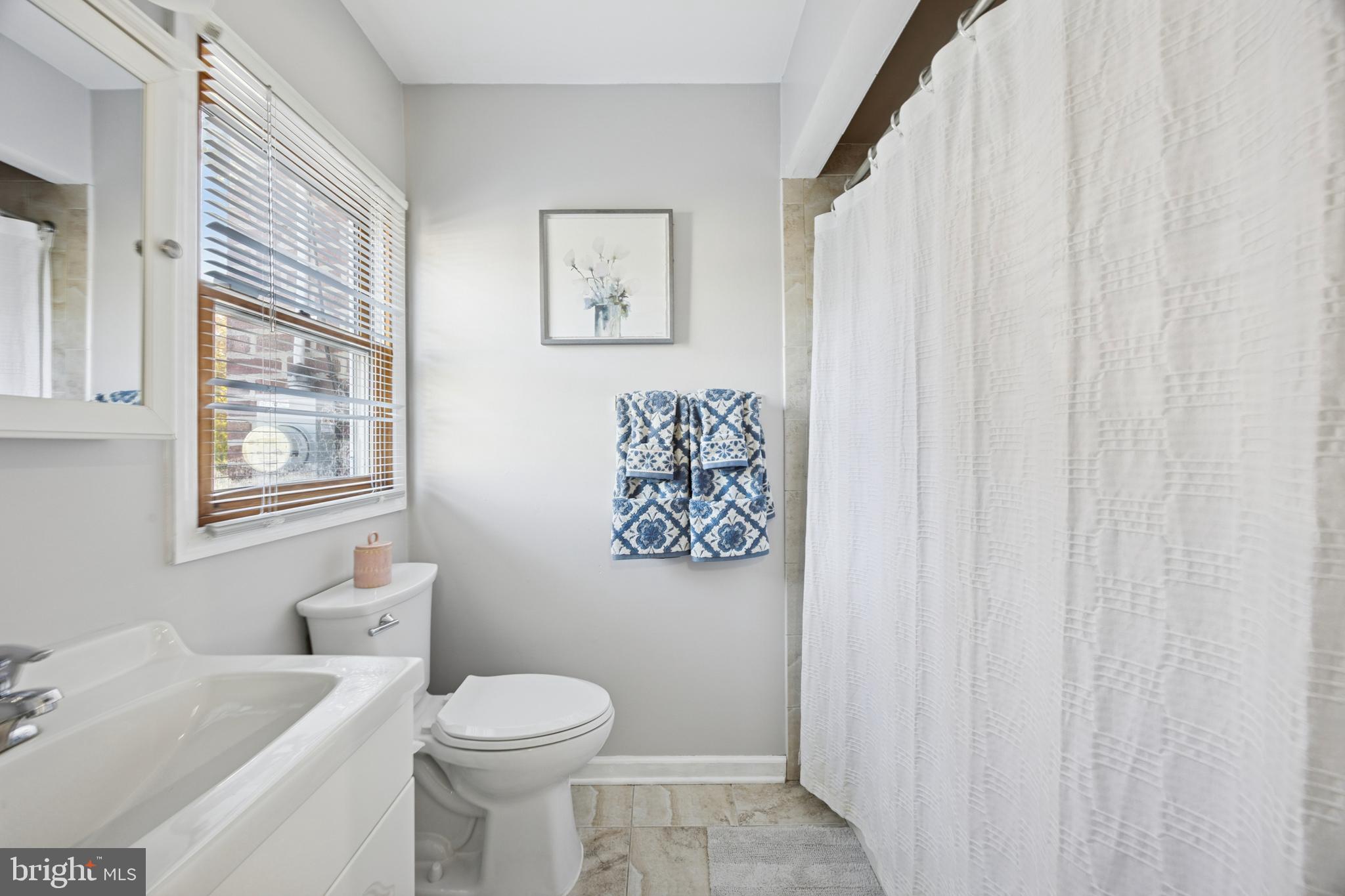 487 East Springfield Road Springfield, PA 19064 - Photo 17 of 29 a white toilet sitting next to a bathroom sink