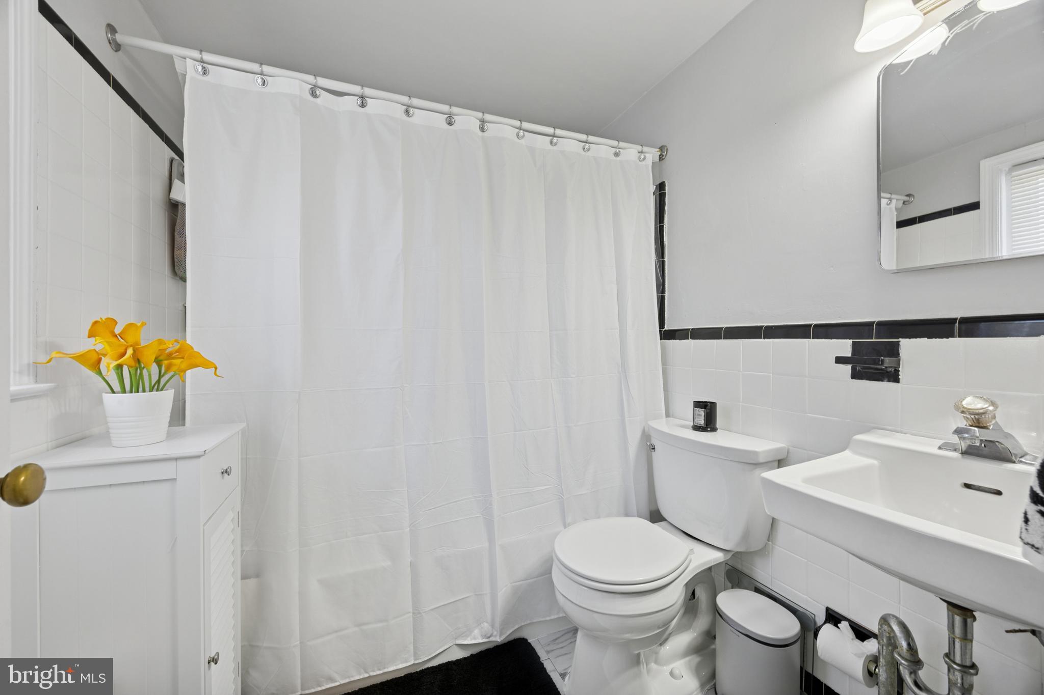 487 East Springfield Road Springfield, PA 19064 - Photo 18 of 29 a white toilet sitting next to a bathroom sink