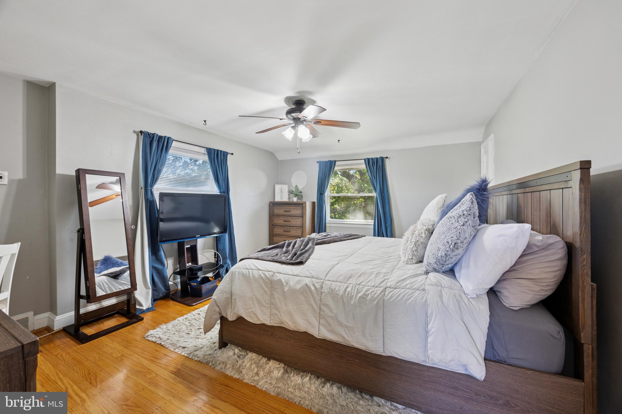 487 East Springfield Road Springfield, PA 19064 - Photo 19 of 29 a bedroom with a bed and a chandelier