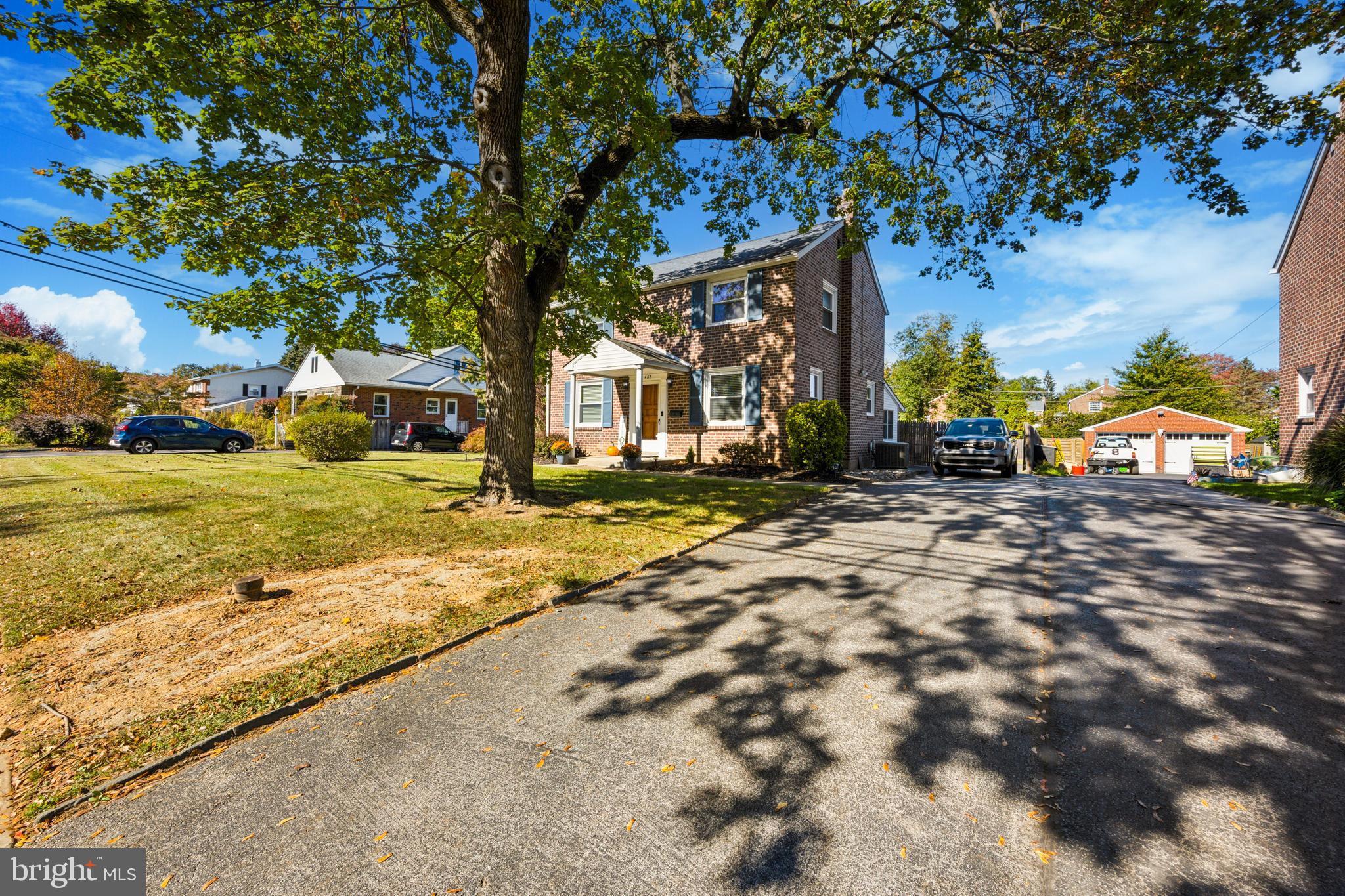 487 East Springfield Road Springfield, PA 19064 - Photo 2 of 29 a front view of a house with a yard