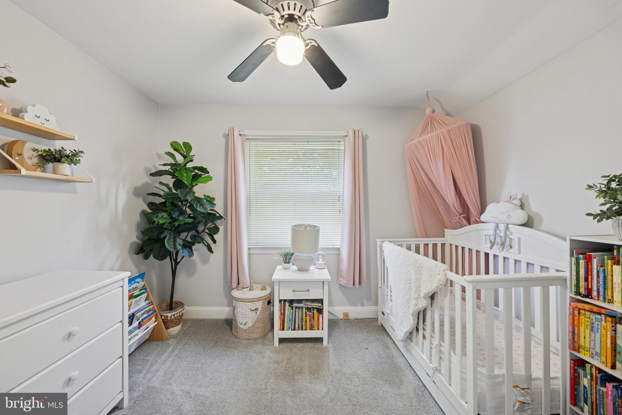 487 East Springfield Road Springfield, PA 19064 - Photo 23 of 29 a bedroom with furniture and a book shelf