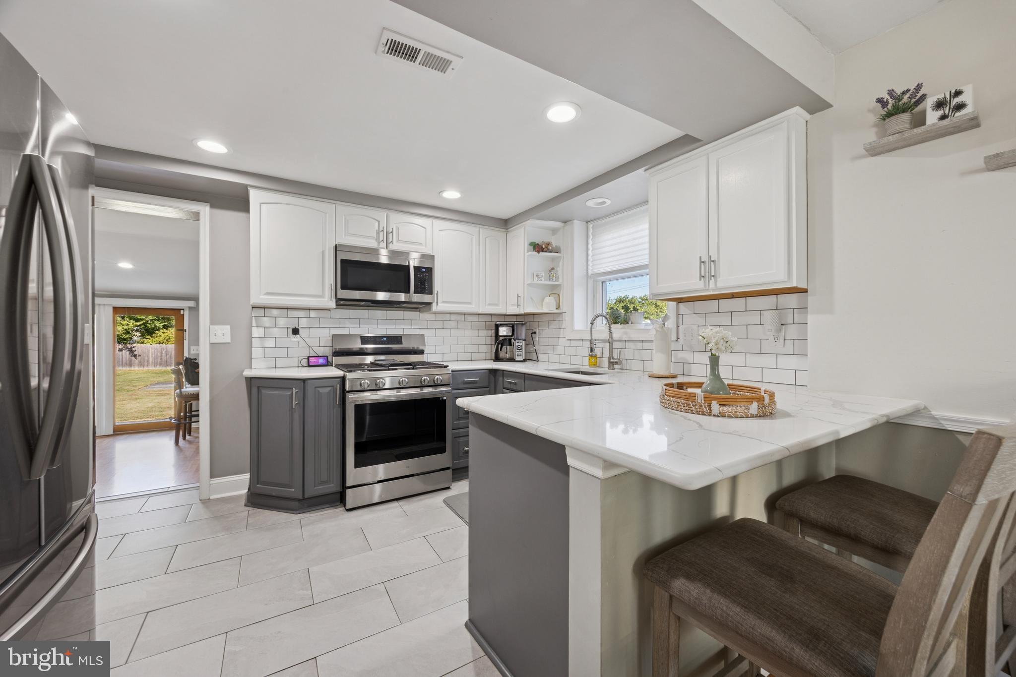 487 East Springfield Road Springfield, PA 19064 - Photo 8 of 29 a kitchen with a sink cabinets and stainless steel appliances