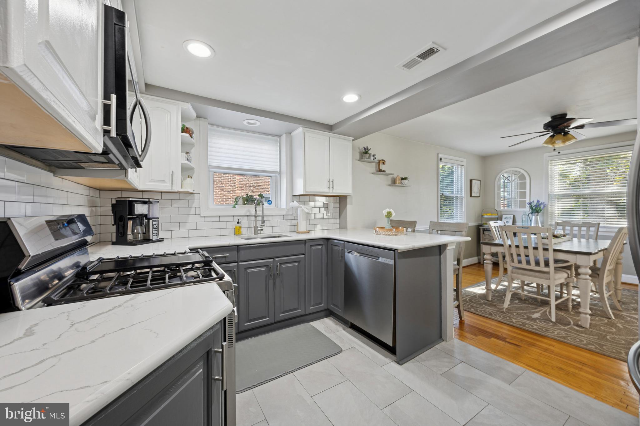487 East Springfield Road Springfield, PA 19064 - Photo 10 of 29 a kitchen with cabinets and a stove top oven