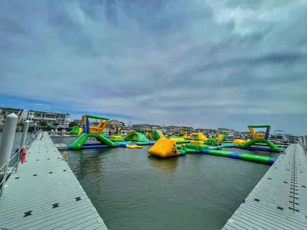 a view of a small deck with a table and chairs