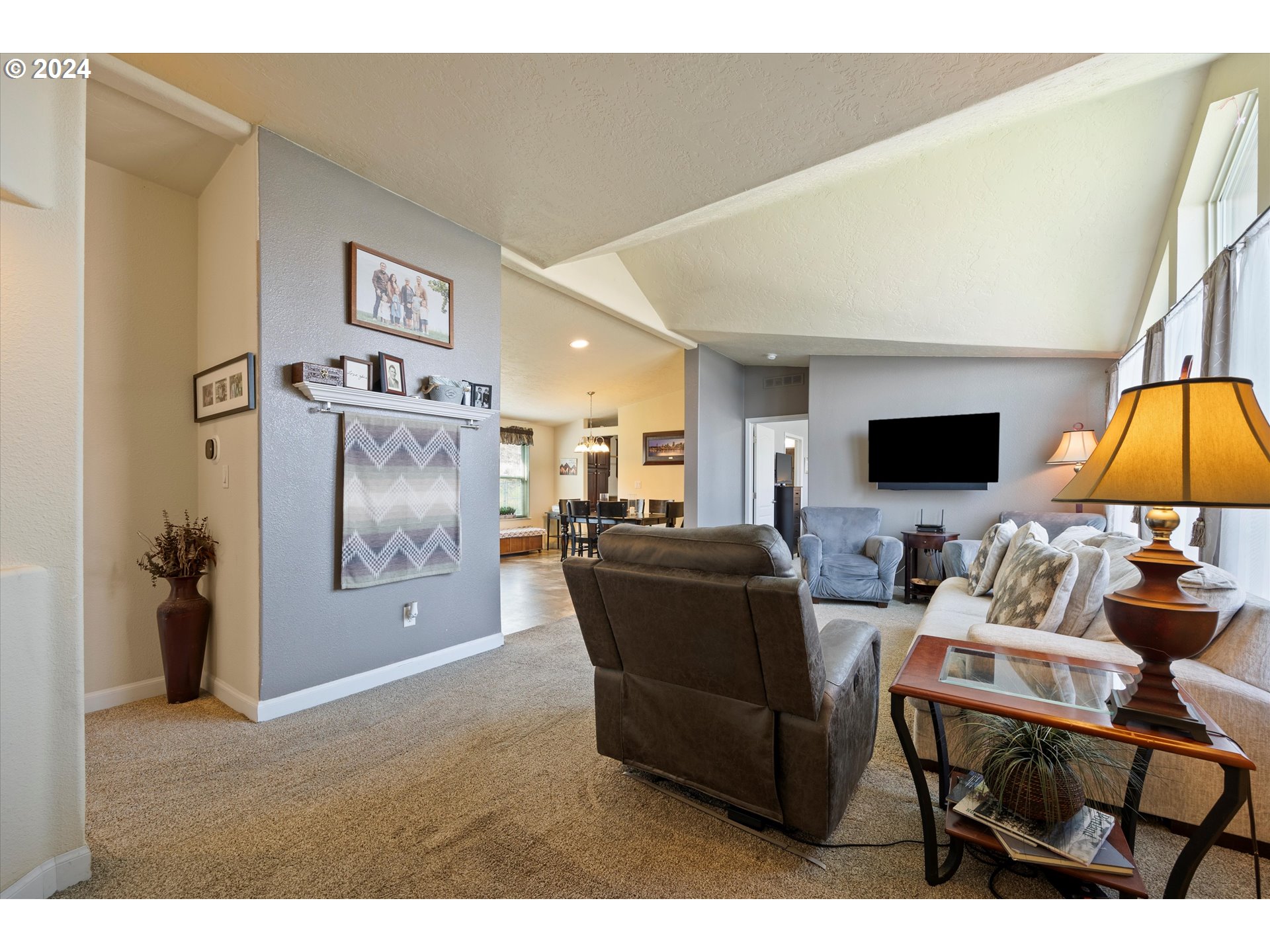 3076 Southwest River View Drive Pendleton, OR 97801 - Photo 12 of 37 a living room with furniture and a flat screen tv