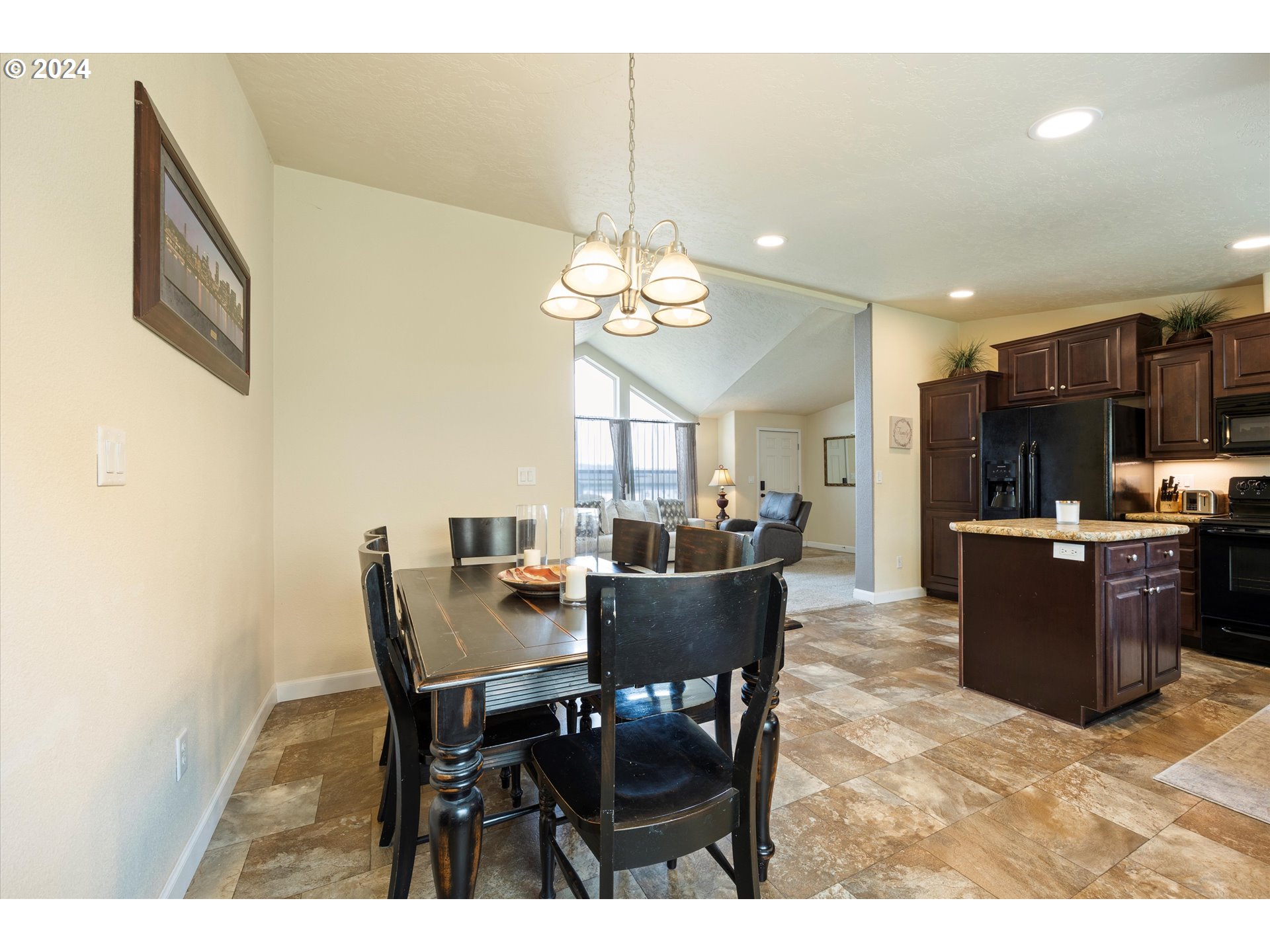 3076 Southwest River View Drive Pendleton, OR 97801 - Photo 20 of 37 a view of a dining room with furniture and a chandelier