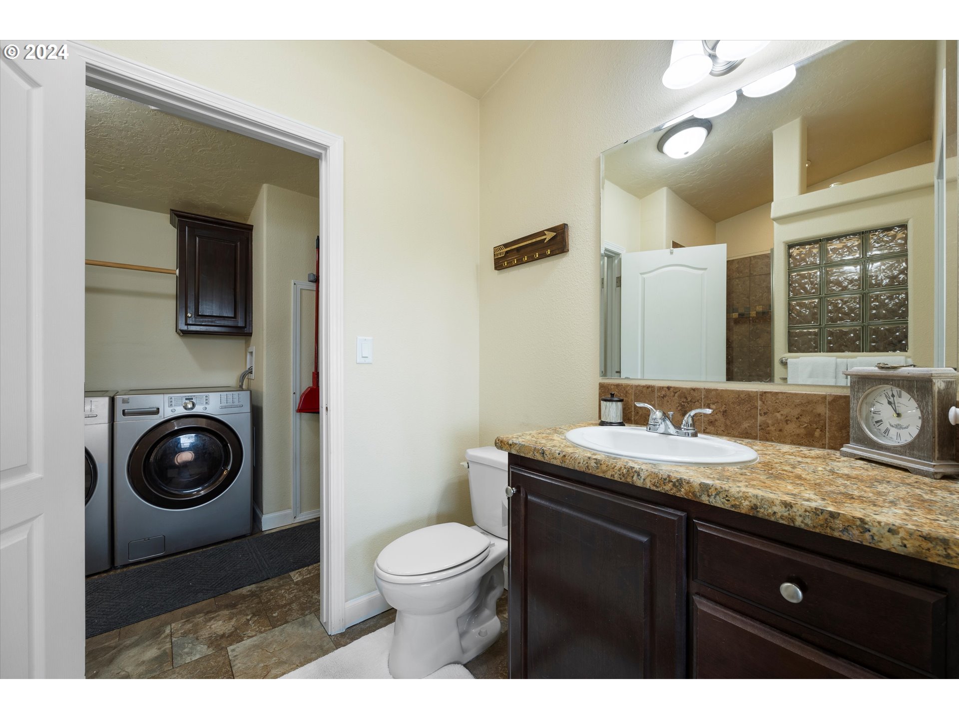 3076 Southwest River View Drive Pendleton, OR 97801 - Photo 23 of 37 a bathroom with a granite countertop toilet sink and mirror