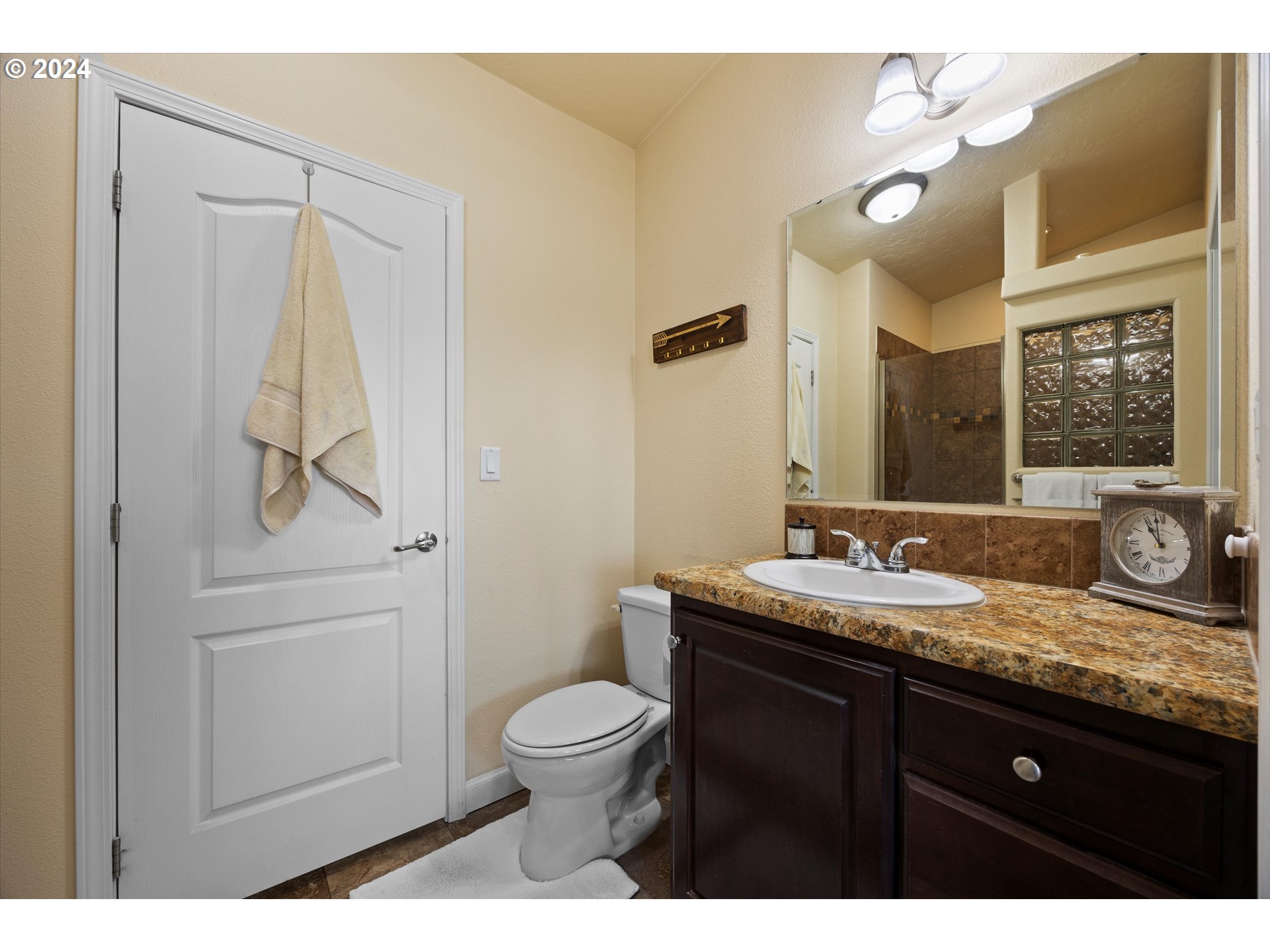 3076 Southwest River View Drive Pendleton, OR 97801 - Photo 24 of 37 a bathroom with a granite countertop sink toilet and mirror