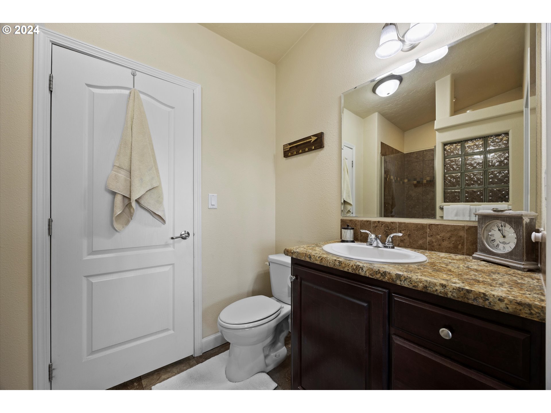 3076 Southwest River View Drive Pendleton, OR 97801 - Photo 25 of 37 a bathroom with a granite countertop sink toilet and mirror