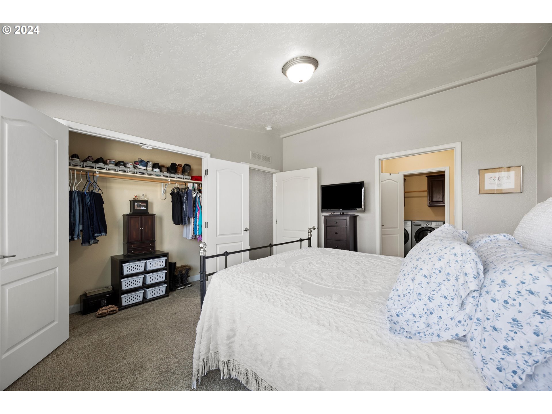 3076 Southwest River View Drive Pendleton, OR 97801 - Photo 31 of 37 a bedroom with a bed and a flat tv screen