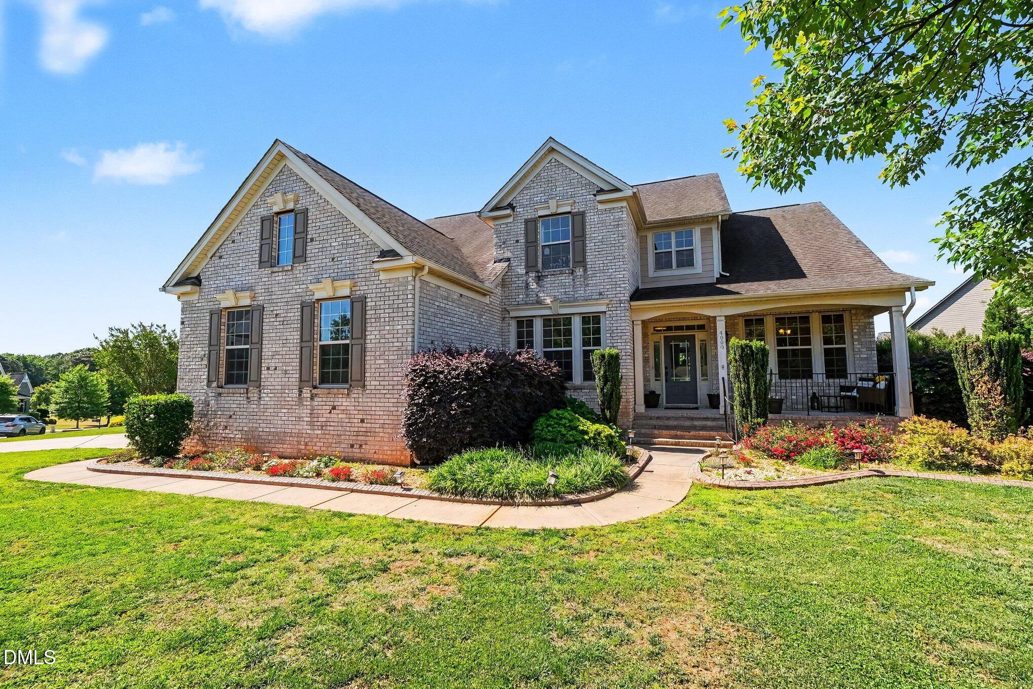 4000 Banks Stone Drive Raleigh, NC 27603 - Photo 58 of 60 a front view of a house with a yard