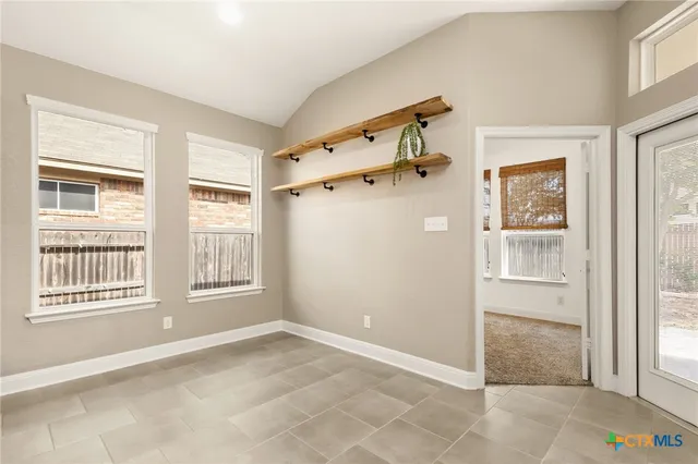 a view of an empty room with a window