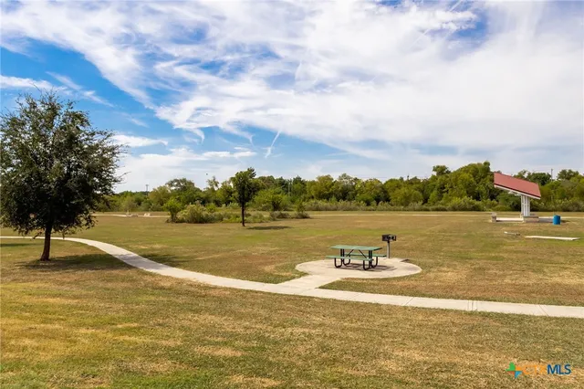 a view of a lake with houses in the back