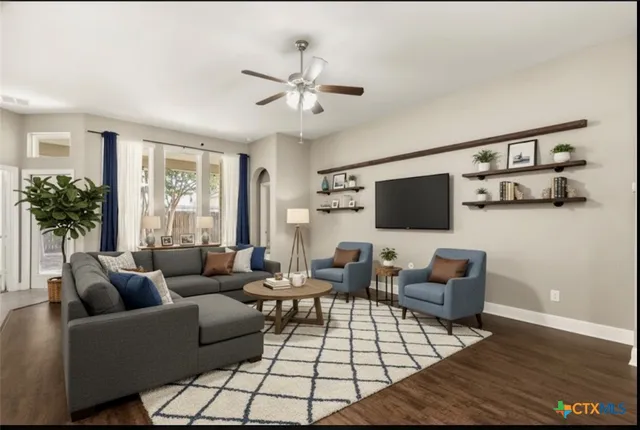 a living room with furniture and a flat screen tv