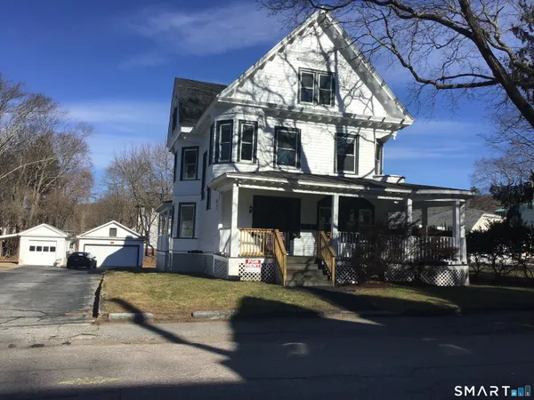 a front view of a house with swimming pool