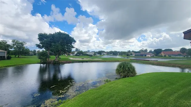 a view of a lake with a big yard