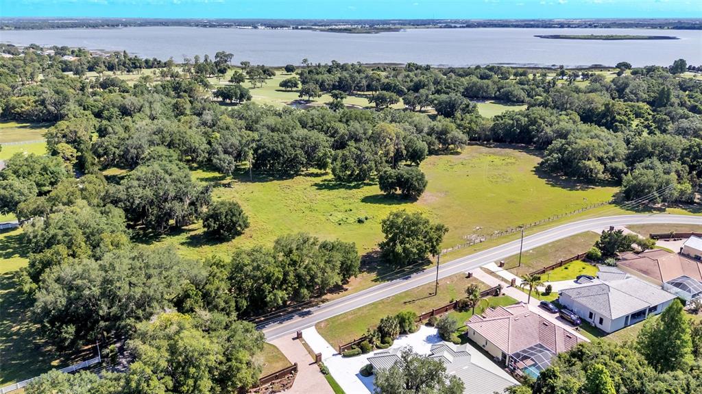 Country Club Road South Winter Haven, FL 33881 - Photo 5 of 6 an aerial view of a house with a garden