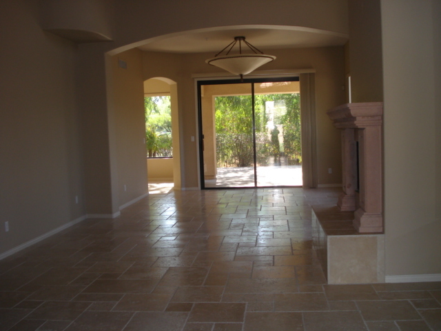 7525 East Gainey Ranch Road, Unit 111 Scottsdale, AZ 85258 - Photo 3 of 38 LIVING ROOM W TRAVERTINE FLOORS