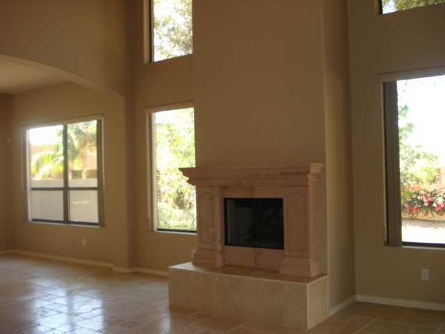 7525 East Gainey Ranch Road, Unit 111 Scottsdale, AZ 85258 - Photo 4 of 38 TERRA COTTA FIREPLACE IN LIVING ROOM