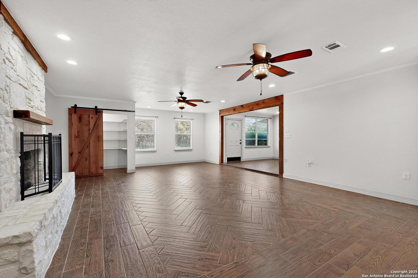 7140 Tree Bend Street China Grove, TX 78263 - Photo 11 of 49 an empty room with windows and ceiling fan