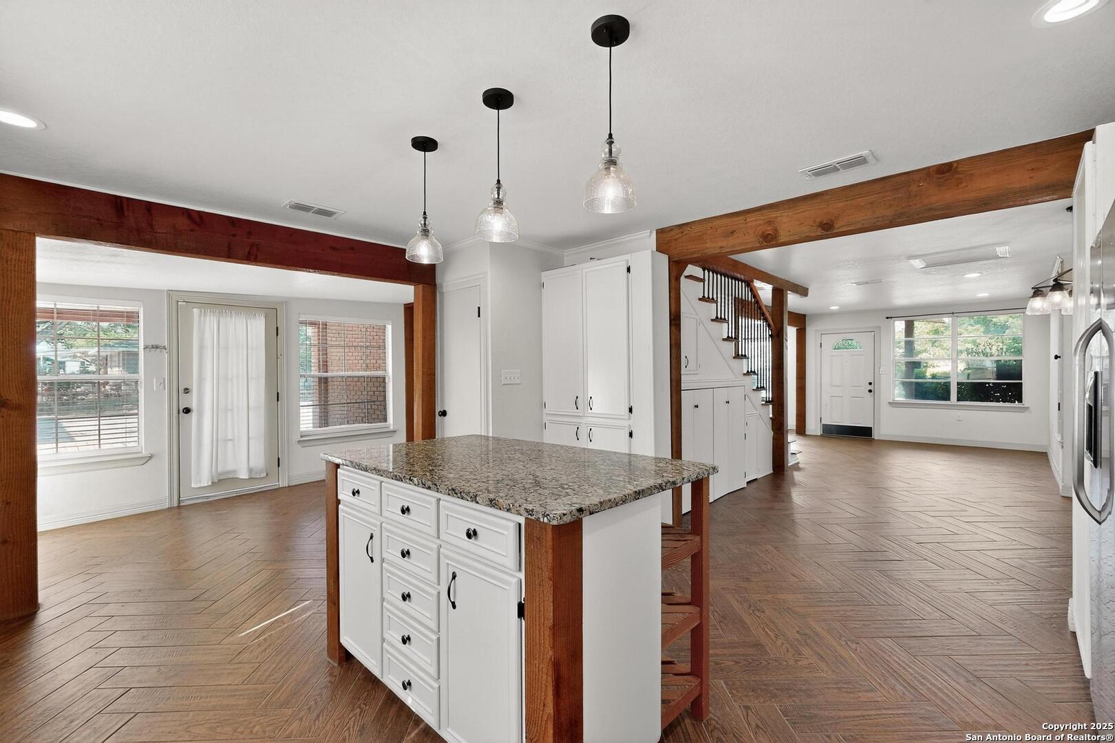 7140 Tree Bend Street China Grove, TX 78263 - Photo 15 of 49 a view of a kitchen with a sink and wooden floor