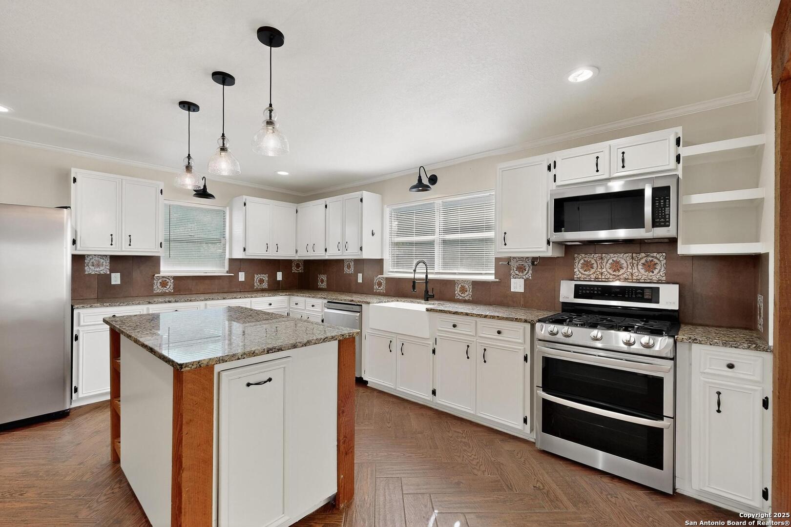 7140 Tree Bend Street China Grove, TX 78263 - Photo 18 of 49 a kitchen with a stove sink and microwave