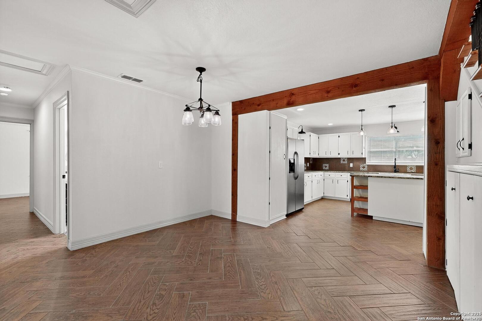 7140 Tree Bend Street China Grove, TX 78263 - Photo 19 of 49 a view of a kitchen with refrigerator and white cabinets