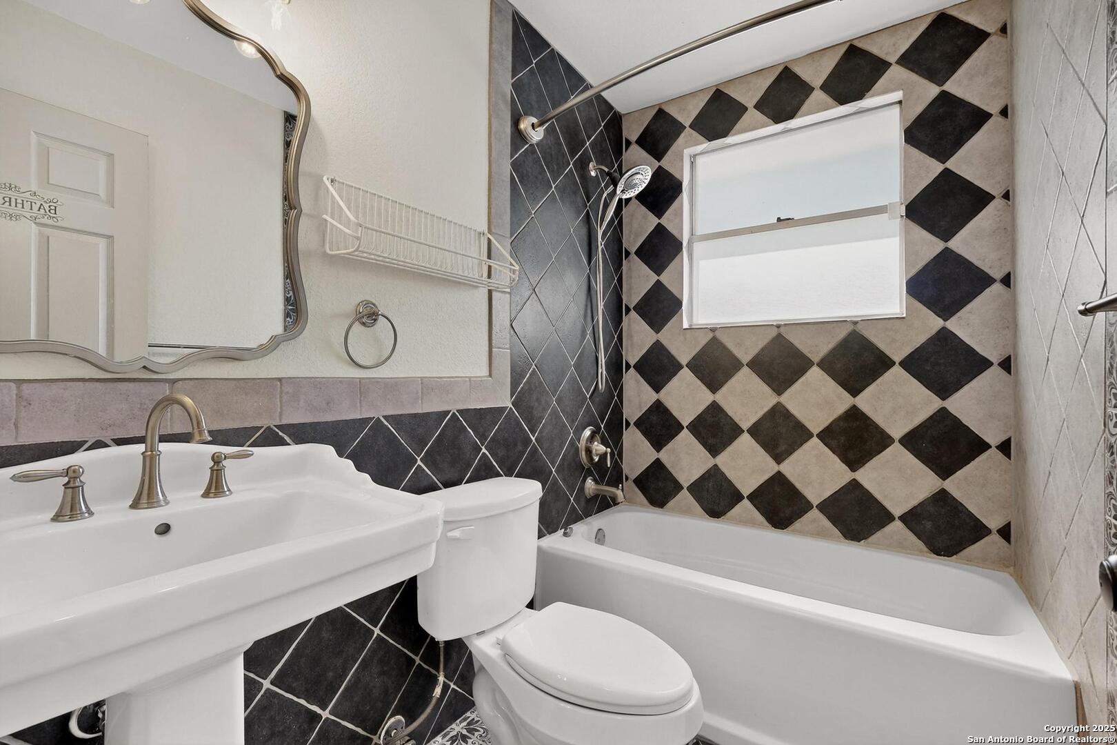 7140 Tree Bend Street China Grove, TX 78263 - Photo 21 of 49 a bathroom with a sink a toilet and a shower curtain