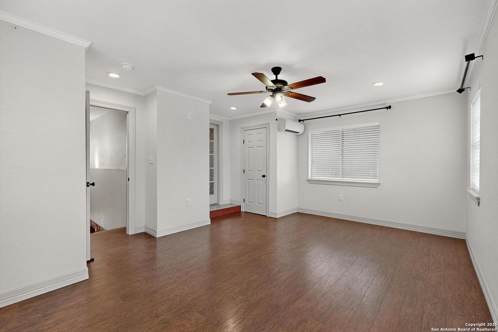 7140 Tree Bend Street China Grove, TX 78263 - Photo 26 of 49 a view of an empty room with a window and wooden floor