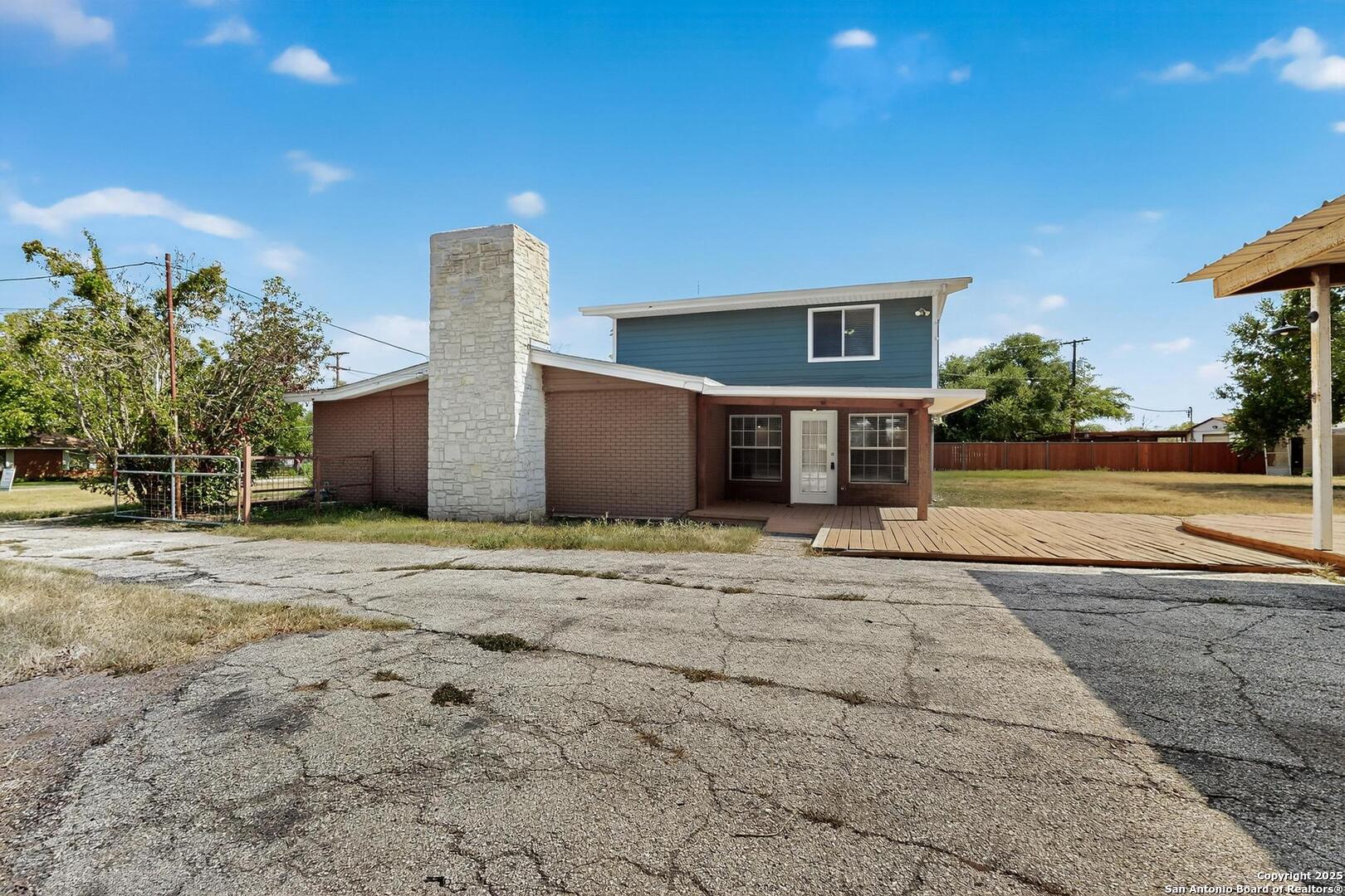 7140 Tree Bend Street China Grove, TX 78263 - Photo 32 of 49 a front view of a house with a yard and garage