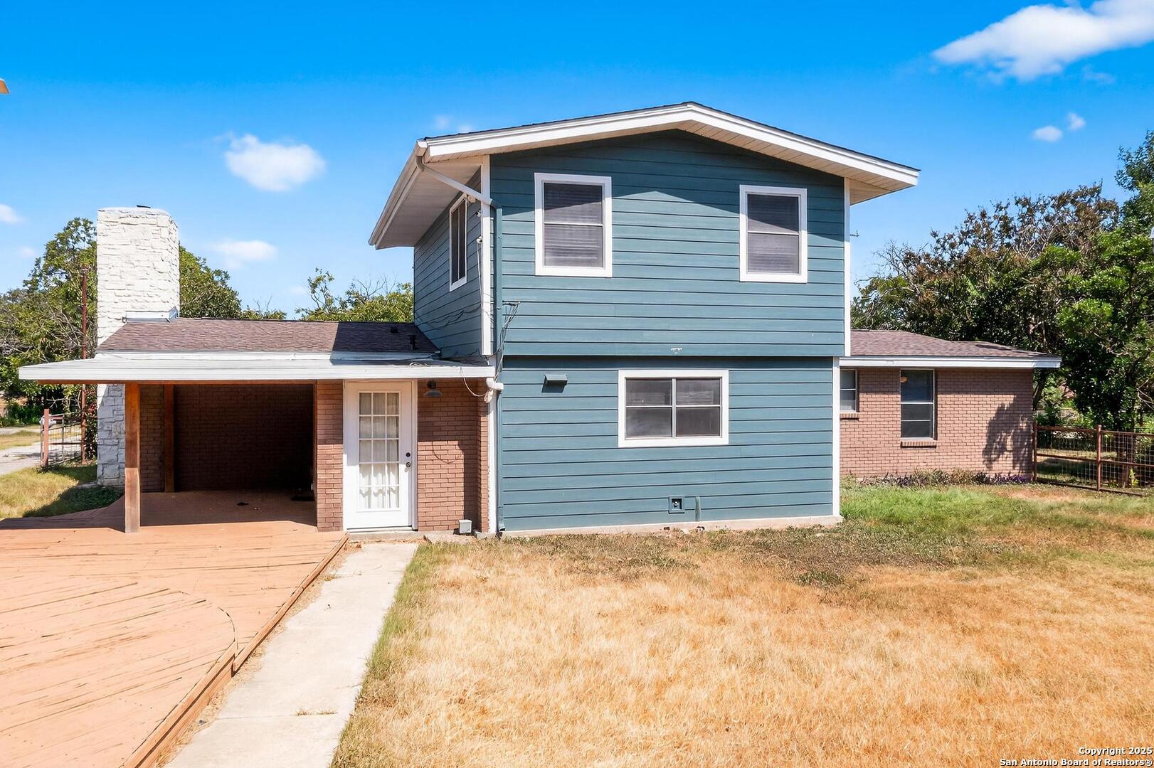 7140 Tree Bend Street China Grove, TX 78263 - Photo 43 of 49 a front view of a house with a yard