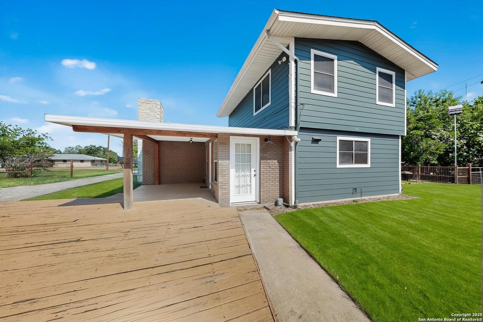 7140 Tree Bend Street China Grove, TX 78263 - Photo 48 of 49 a front view of a house with a yard and garage