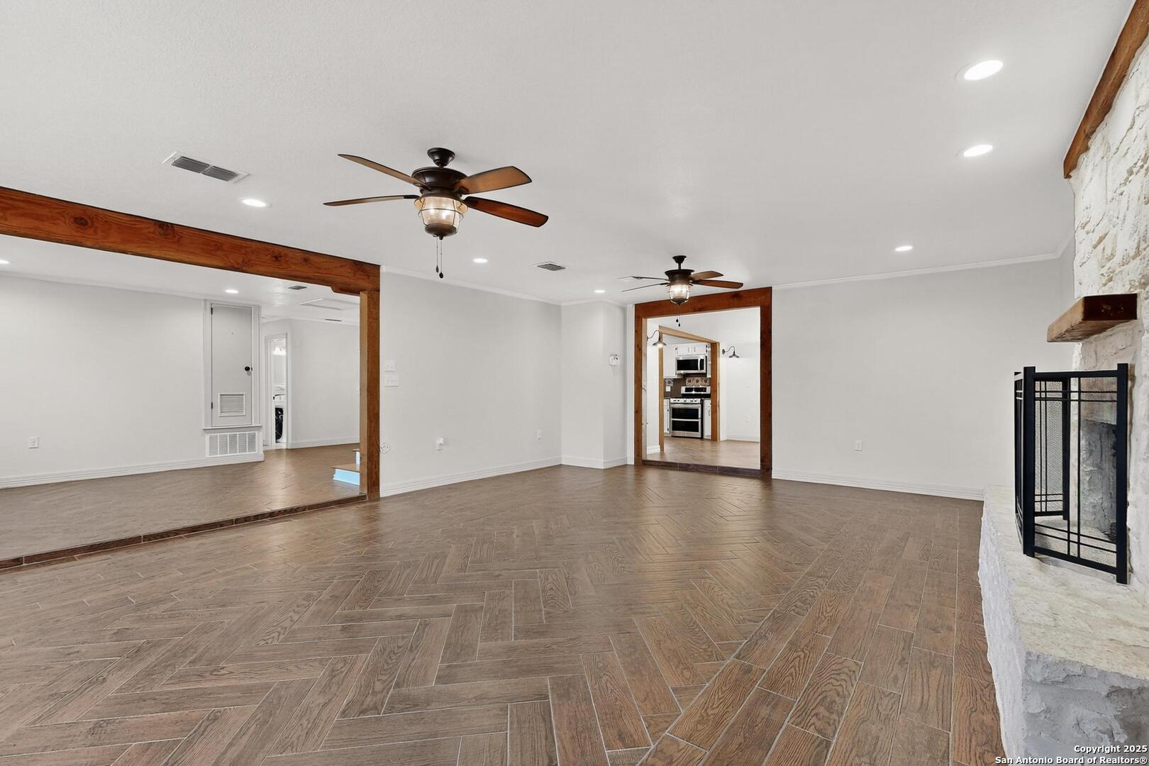 7140 Tree Bend Street China Grove, TX 78263 - Photo 9 of 49 a view of an empty room with window and wooden floor