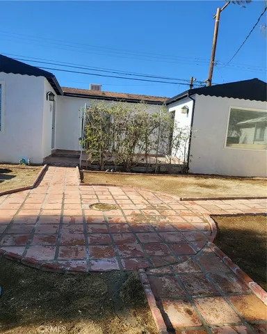 a view of a backyard of a house