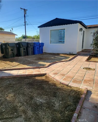 a view of backyard with large trees