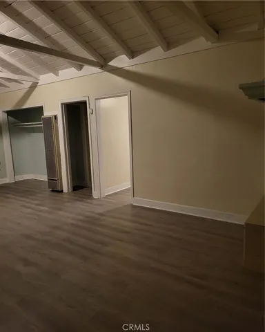 a kitchen with a sink and a mirror