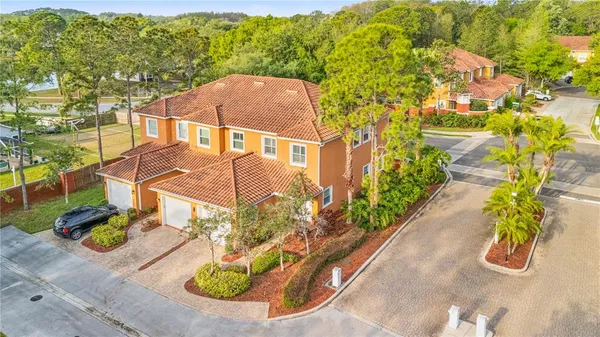 an aerial view of a house with swimming pool garden and patio