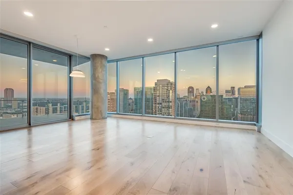 a view of room window and wooden floor