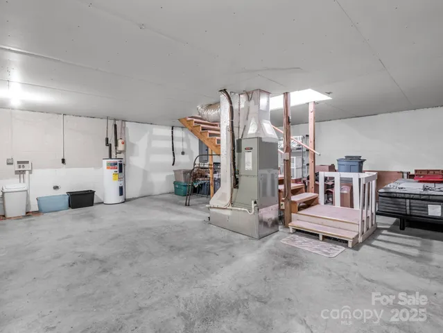a view of a livingroom with furniture and white walls