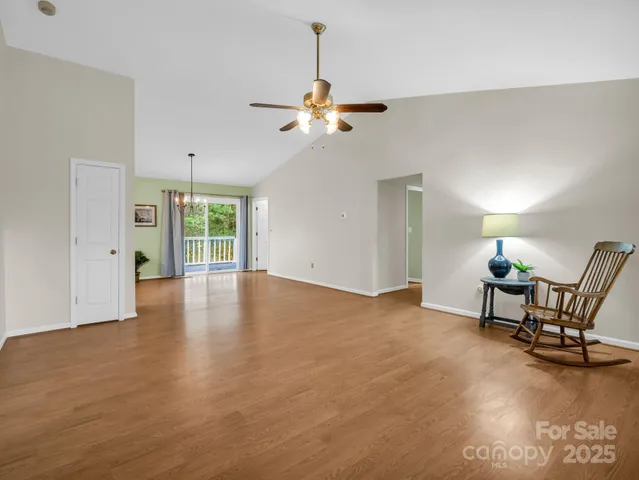 a view of a livingroom with furniture and a chandelier