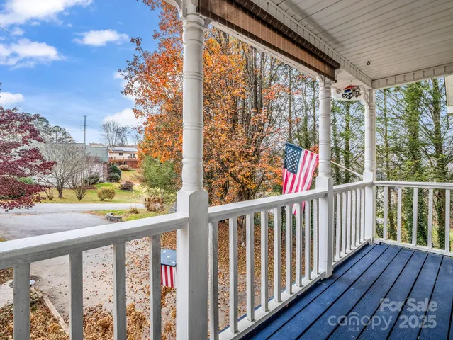 a view of a balcony with wooden floor