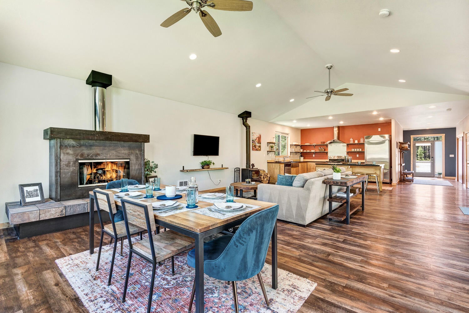17256 Tholstrup Road Bend, OR 97707 - Photo 10 of 28 Great room dining, fireplace, kitchen
