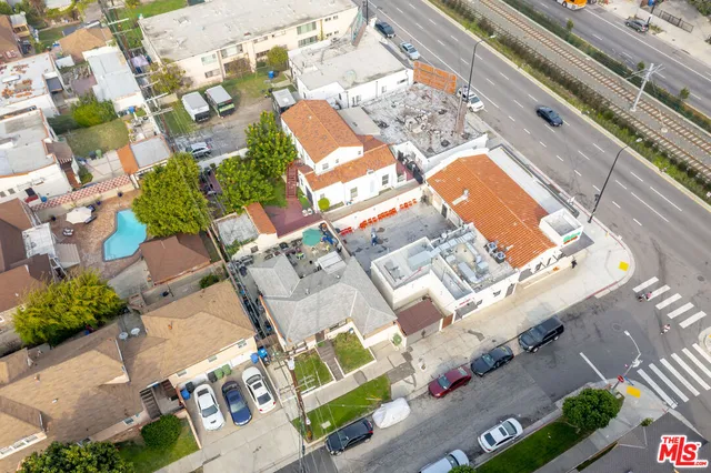 a picture of a building with a lot of flower plants