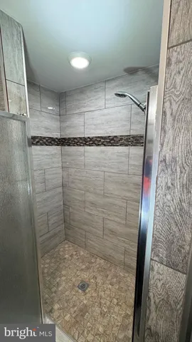 a view of a dining room with furniture wooden floor and flat screen tv